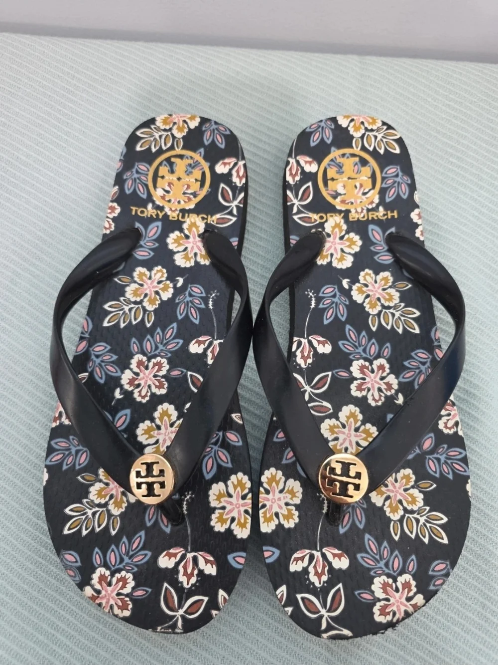 Tory Burch Navy Floral Logo Flip Flops with Gold Medallions